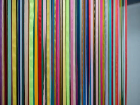 Multicolored ribbons hanging from ceiling Stock Photos