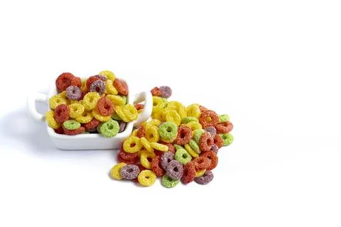 Multicolored ring shaped cereals on white background Stock Photos