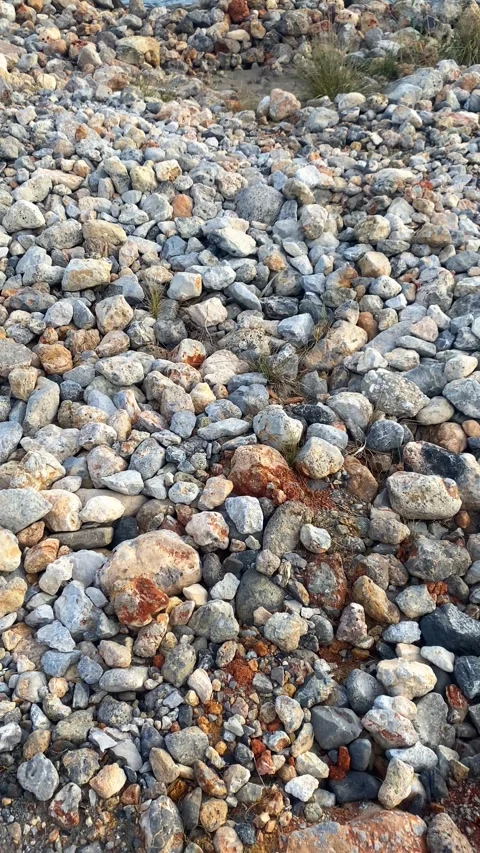 Multicolored rocks on the seashore. Vertical video for social networks Stock Footage 287342001