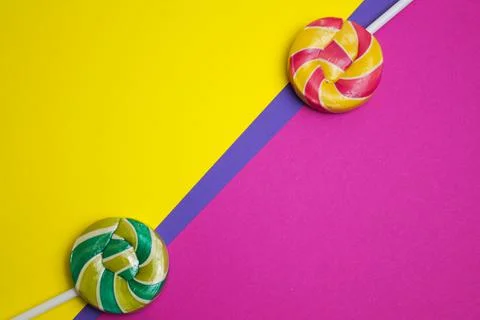 Multicolored round lollipops on a multicolored background. valentine's day. Stock Photos