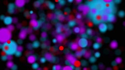 Multicolored round particles fly on a black background. abstract looped animatio Stock Footage 100651233