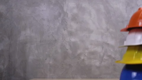 Multicolored Safety Construction Worker Hats. Teamwork of the construction team Stock Footage 150645463