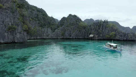 Multicolored seabed in front of rock formations by drone Stock Footage 102827710