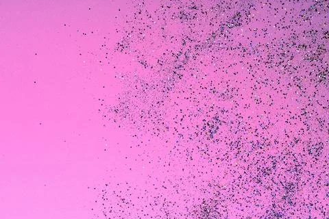 Multicolored sequins on a bright pink background. Foto stock