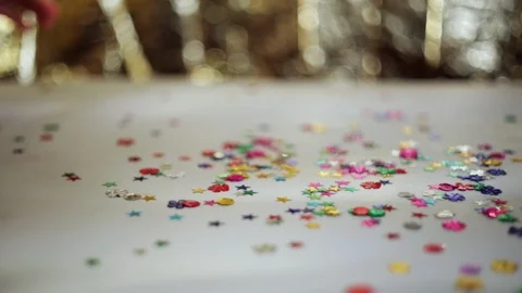 Multicolored sequins collecting by hand. Stock Footage 98313641
