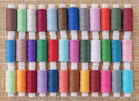 Multicolored sewing threads. Spools of thread for sewing. Stock Photos