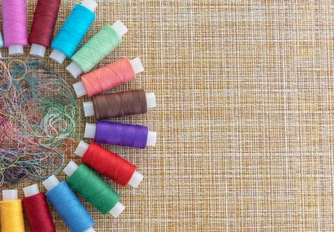 Multicolored sewing threads. Spools of thread for sewing. Stock Photos