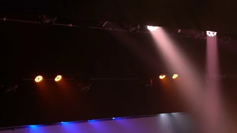 Multicolored shades of light rays. Ceiling with lighting fixtures on the dance Stockbeeldmateriaal 197732032