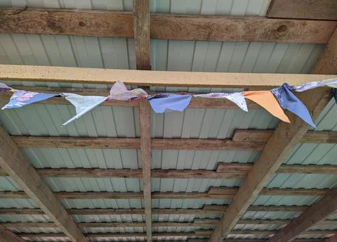 Multicolored small triangular flags in the wind Stock Photos