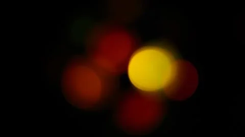 Multicolored soft bokeh on a black background Stock Photos