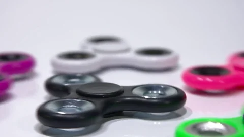 Multicolored spinners are spinning. Video stock 77730718