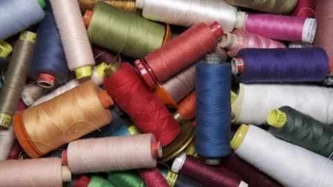Multicolored spools and spools of cotton yarn for the tailoring industry Stock Footage 148057434