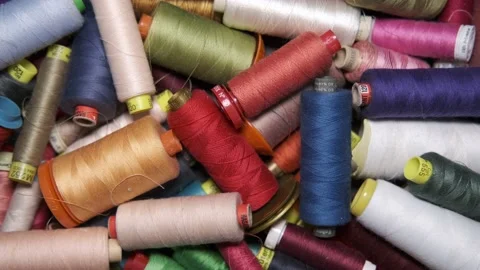 Multicolored spools and spools of cotton yarn for the tailoring industry Stock Footage 148060185