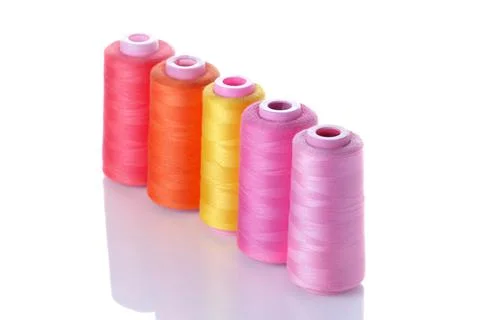 Multicolored spools with threads on white isolated background. accessories fo Stock Photos