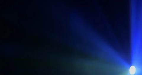 Multicolored Spotlight Beam Through Smoke. Anamorphic Lens. Video stock 324803902