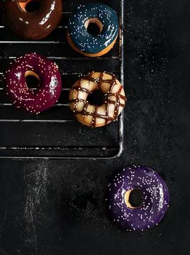 Multicolored sprinkled donuts 스톡 사진