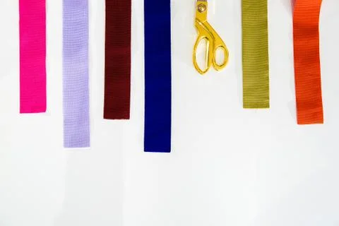 A multicolored stack of fabrics - the fabrics lie on top of each other, the f Stock Photos