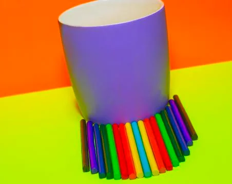Multicolored sticks with a mug Stock Photos