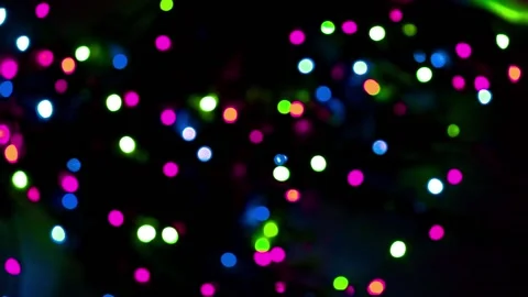 Multicolored street lights bokeh on a dark background slow motion Stock Footage 166125607