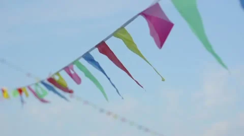 Multicolored striped triangular flags on a rope Stock Footage 8997103