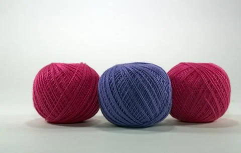 Multicolored tangles of natural cotton for needlework on a white background Stock Photos