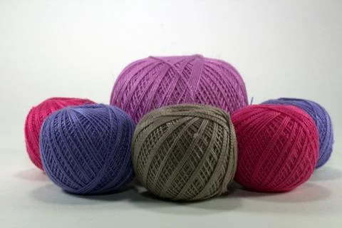 Multicolored tangles for needlework from natural cotton on a white background Stock Photos