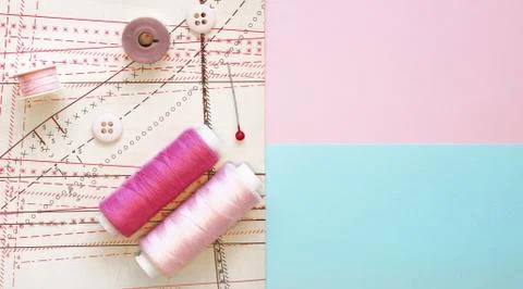 Multicolored thread coils on color background. Sewing supplies, pattern 写真素材