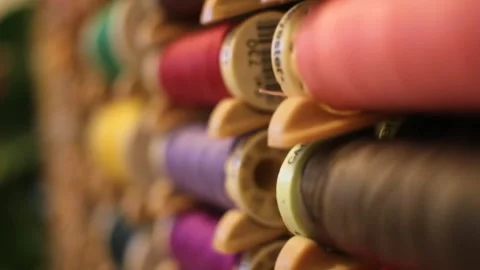 Multicolored thread spools stacked orderly Stock Footage 324681817