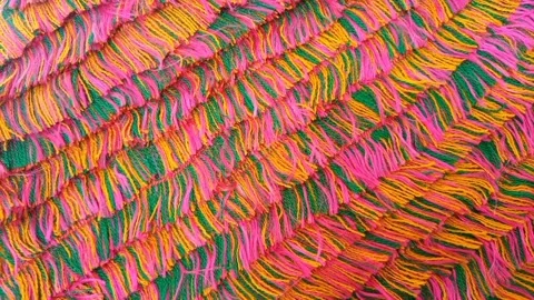 Multicolored thread strands rotating texture background, top view of downward Stock Footage 282096705