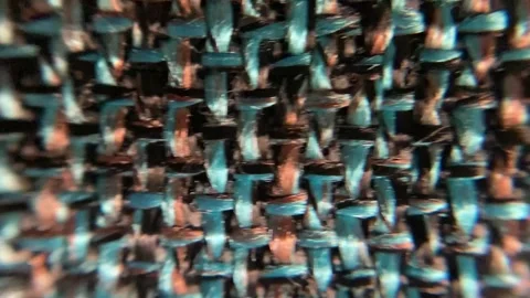 Multicolored threaded fabric with rough texture Stock Footage 333416638