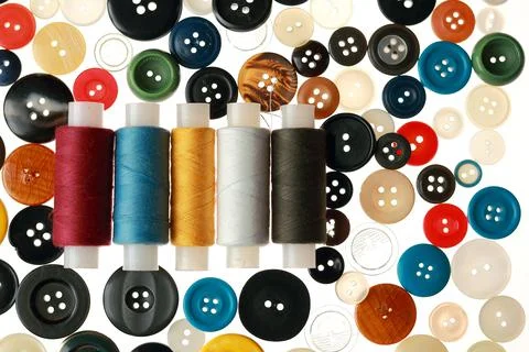 Multicolored threads and buttons for clothes. Stock Photos