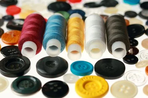 Multicolored threads and buttons for clothes. Stock Photos