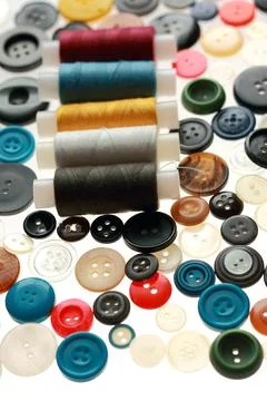 Multicolored threads and buttons for clothes. Stock Photos