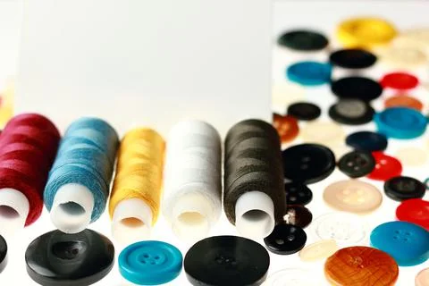 Multicolored threads and buttons for clothes. Stock Photos