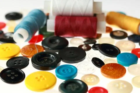 Multicolored threads and buttons for clothes. Stock Photos