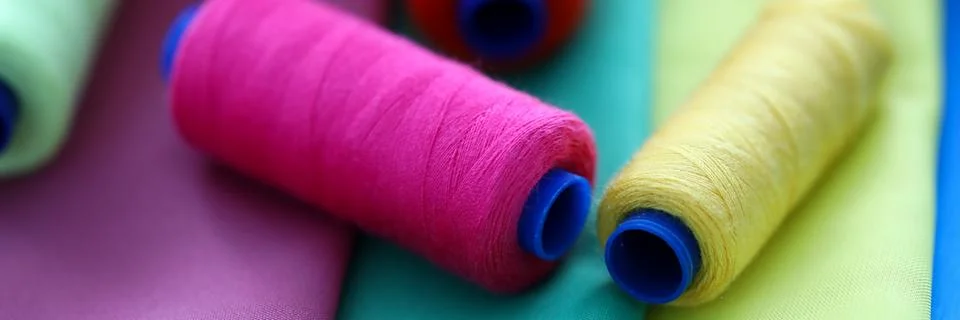 Multicolored threads on coils Stock Photos