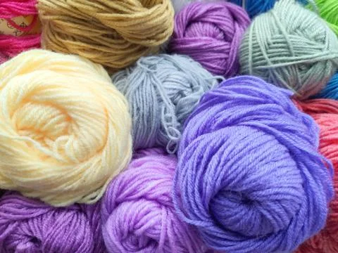 Multicolored Threads colorful Background woolen skeins close-up Stock Photos