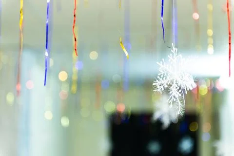 Multicolored threads of New Year's tinsel in the entrance of the house Stock Photos