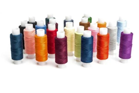 Multicolored threads for sewing on spools Stock Photos