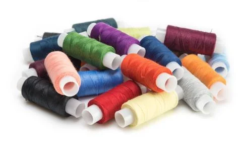Multicolored threads for sewing on spools Stock Photos