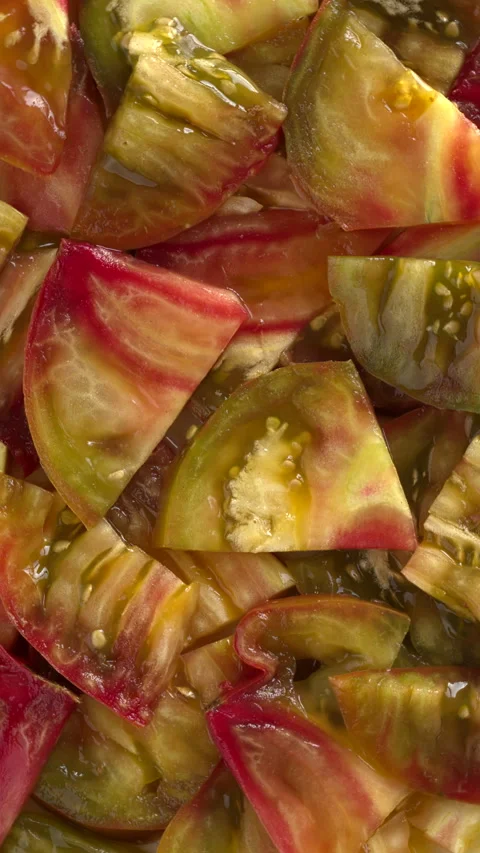 Multicolored tomato slices background texture. Vertical video. Stock Footage 283139645