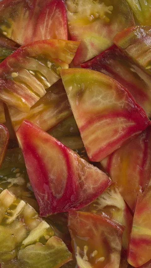 Multicolored tomato slices background texture. Seamless loop. Stock Footage 284566900