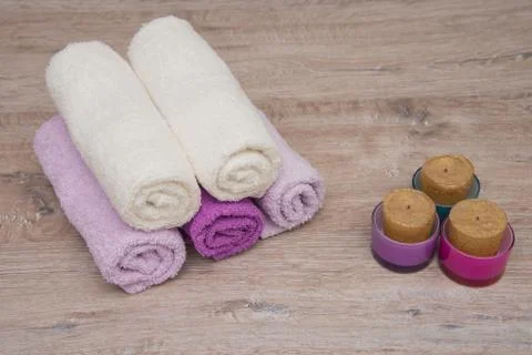 Multicolored towels on a wooden background Foto stock