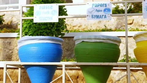 Multicolored trash bins, for sorting waste, on the beach. Stock-Footage 136895838