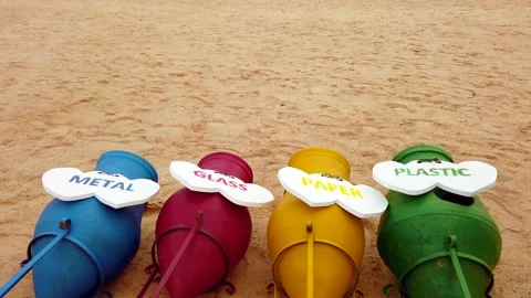 Multicolored trash cans on the beach Stock Footage 146076707