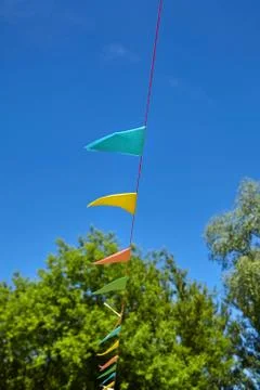 Multicolored triangular paper festival flags Stock Photos