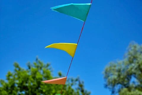 Multicolored triangular paper festival flags Stock Photos