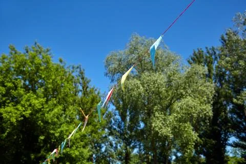 Multicolored triangular paper festival flags Stock Photos