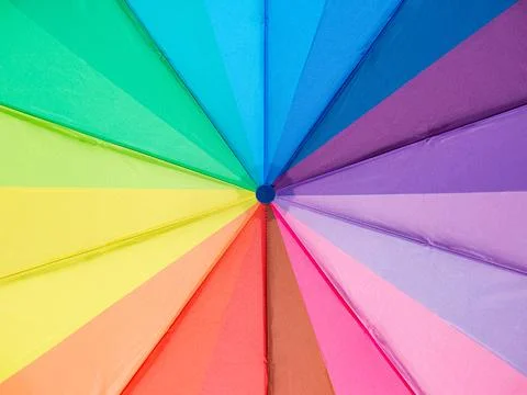 Multicolored umbrella close-up. Colors of the LGBT community. Background, tex Stock Photos