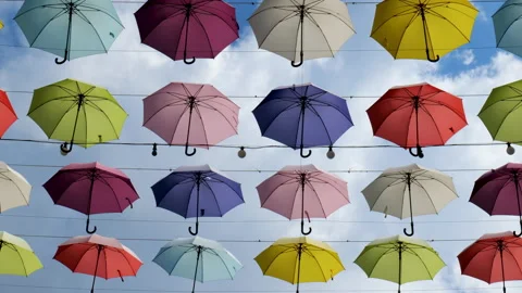 Multicolored umbrellas hanging high Stockbeeldmateriaal 172299625